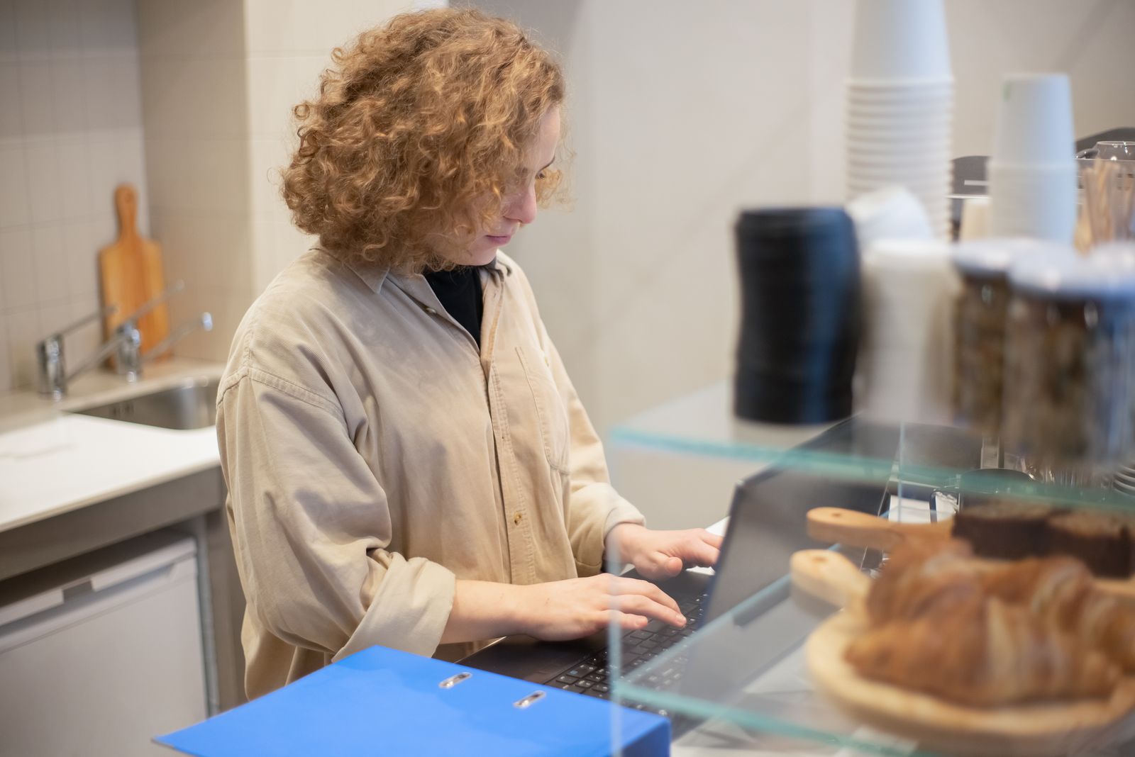Independent restaurant owner preparing a counter for customers